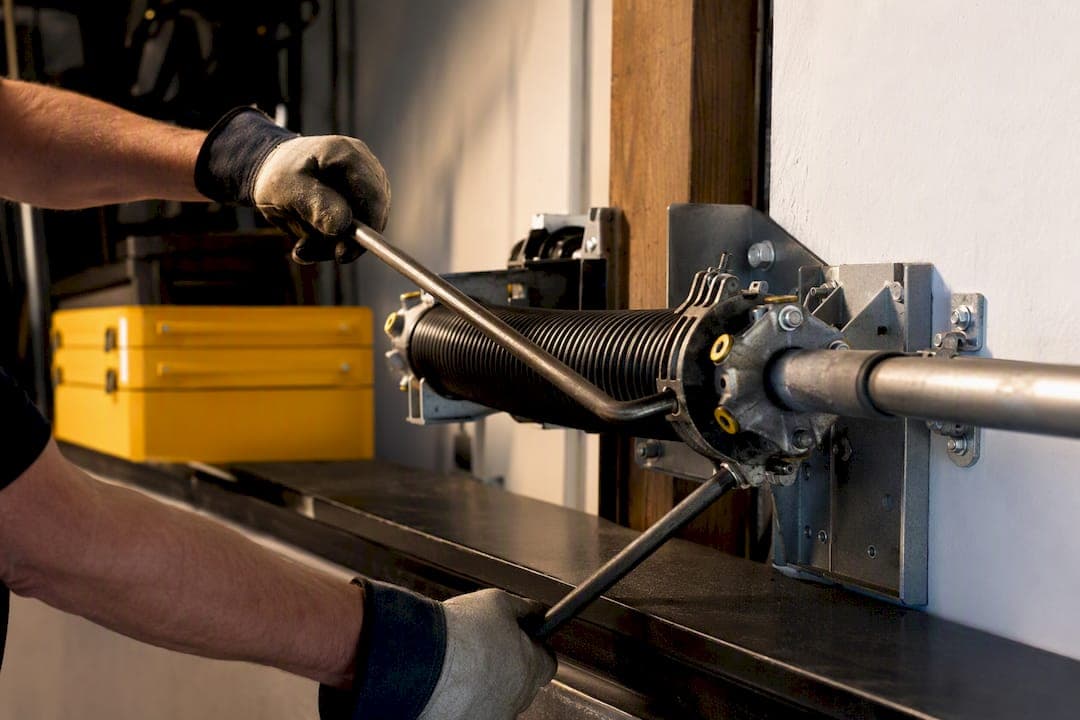 10,000 Cycles: How Homeowners Should Replace Torsion Springs Safely
